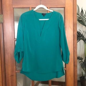 3/4 length Kelly green colored Limited blouse
